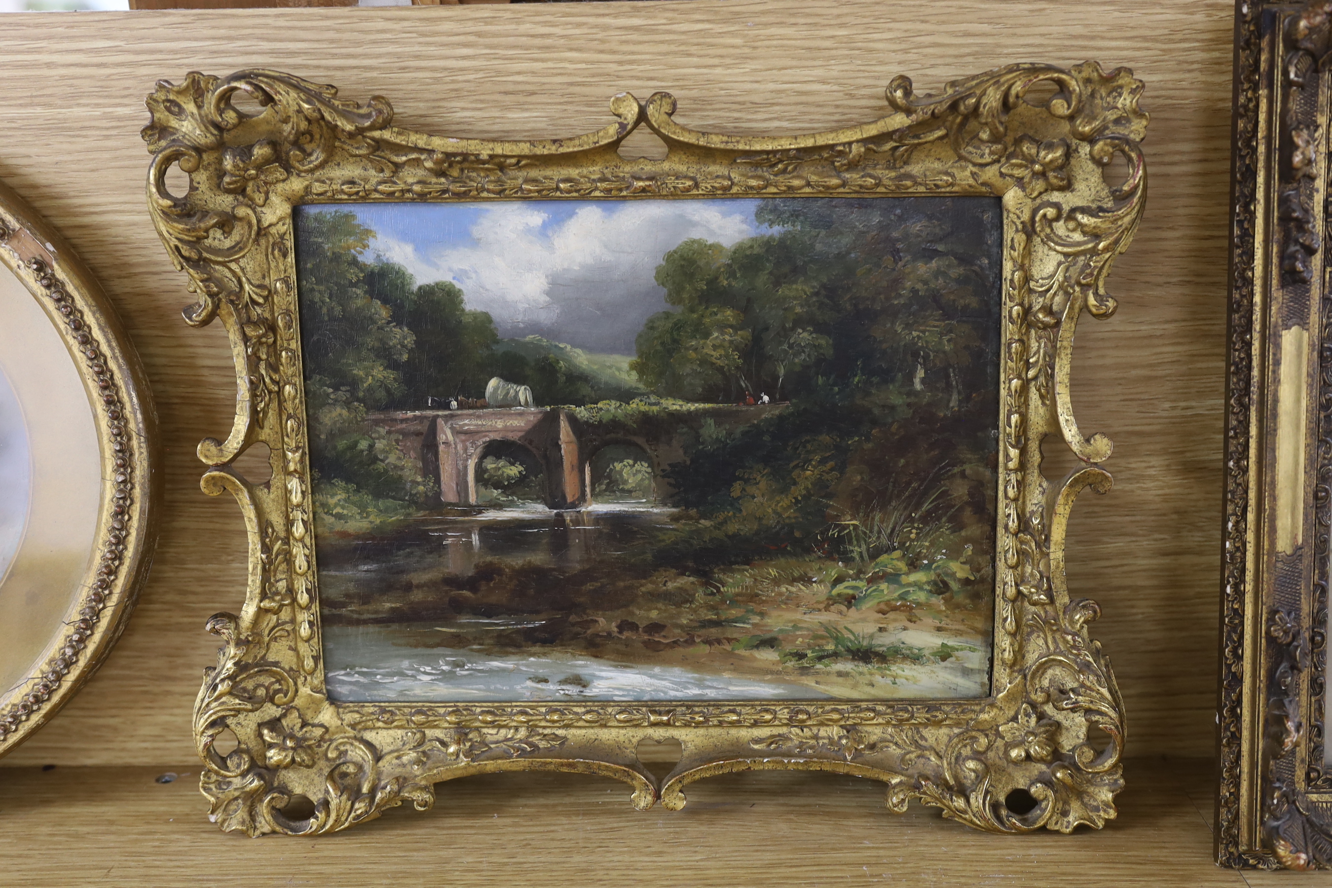 English School, oil on board, Cart and figures crossing a stone bridge, 21 x 28cm